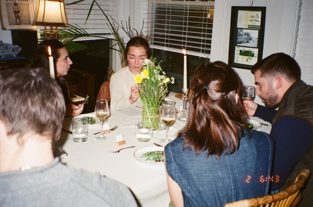 Guests sharing a meal together at an e's supper club supper